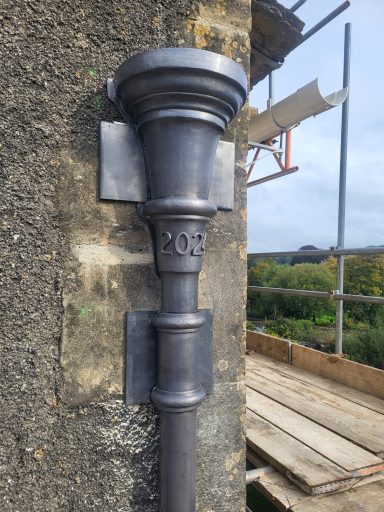 Bossed lead rainwater hopper head with date 2025