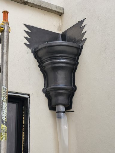 Bossed lead hopper head for a property in Eaton Square in London